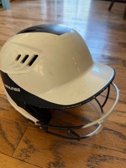 Rawlings softball helmet and under armour cleats