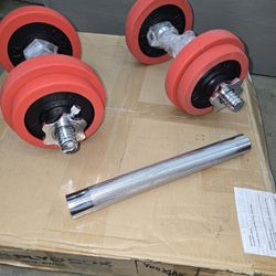 20  LBS EACH DUMBELL 40 LBS. TOTAL WITH CONNECTOR TO MAKE A BARBELL.