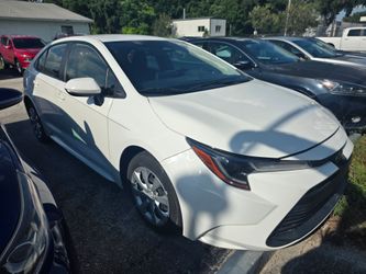 Toyota Corolla Sedan White drive with 1000 down ask for Tailyn