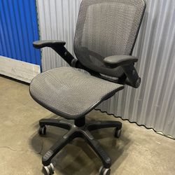 **ESTATE SALE**. Mesh Office Chair Swivels And Raises And Arms Move. 