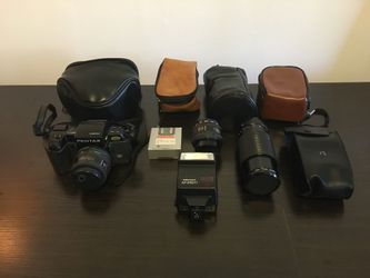 Pentax SF1 with 3 lenses, flash, battery grip and leather cases for all