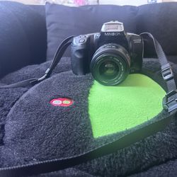 Camera with lens Minolta 300si