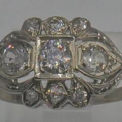 14KT WHITE GOLD ANTIQUE RING SIZE 7.5 2.3 GRAMS 1 CARAT OF DIAMONDS STUNNING PRE OWNED. STUNNING . ANTIQUE WITH APPROXIMATELLY 3 DIAMONDS 0.25PTS ; 2 