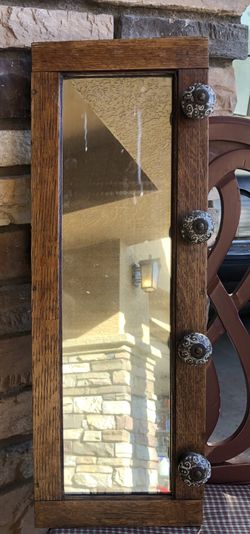 Antique oak frame mirror with knobs hooks