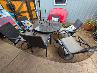 Patio set, table, 4 chairs, and 2 swivel Chairs
50"w x 29"h table
7 items total