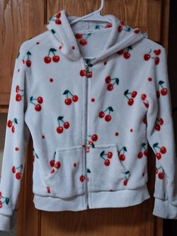 Girls cherry jacket size 12 (L)