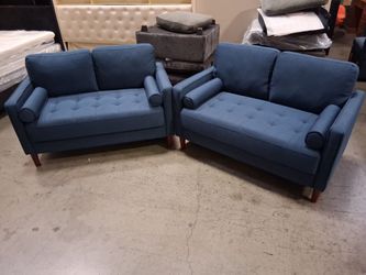 Two blue loveseats