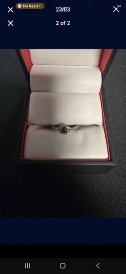 925 silver ring with small diamonds and a sapphire
