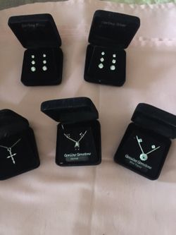 Jewelry 2 necklace & earring sets garnet & blue topaz, silver cross with chain 2 sets of sterling silver cubic Zerconia's each set has 3 pairs differ