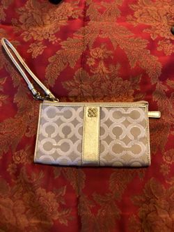 New Coach wristlet gold