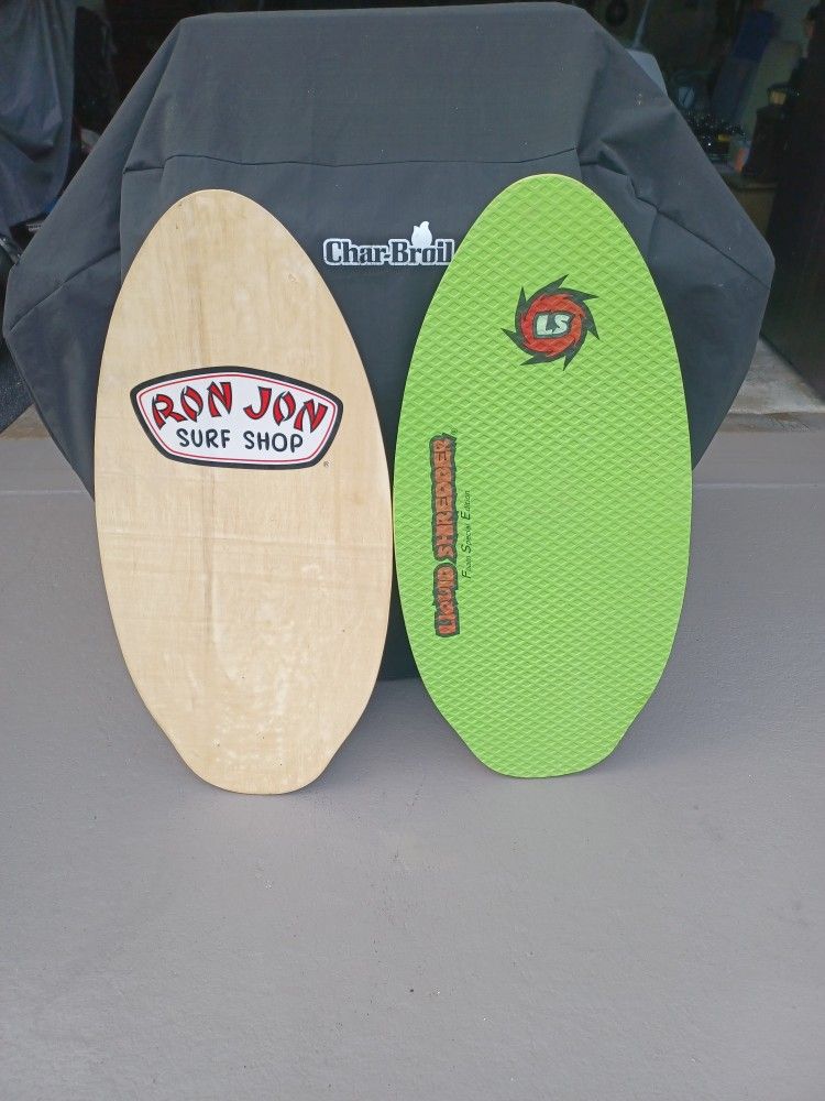 Two boogie boards. Ron Jon, And liquid shredder. Liquid shredder has correlated corrugated soft top both for eighty dollars