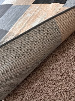 Firm. Pick up today! Low pile area rug  7ft 10in x 10ft 5in