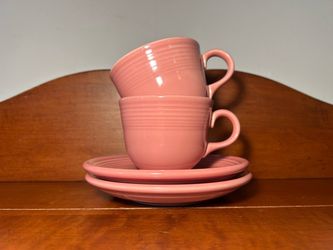 Set of 2 Pink Genuine Fiesta Cups and Saucers Saucers just under 6” diameter  Cups 4 5/8 long x 2.75” tall x 3.5” diameter