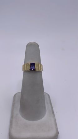 14k gold band ring with purple CZ