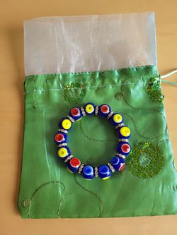 EVIL EYE STRECHABLE BRASLET WITH SILK POUCH - BRAND NEW