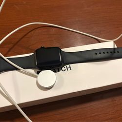 Apple Watch, charger, and box