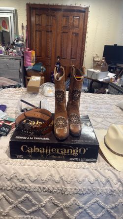 Cow girl leather boots and belt and hat