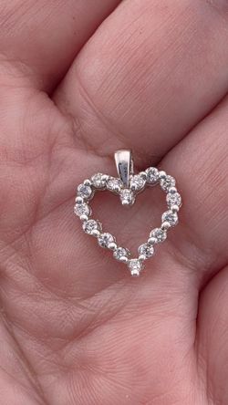 10K gold and diamonds heart pendant.  Designer signed