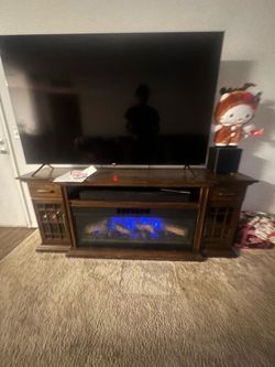 Wooden tv stand w electric heater and storage