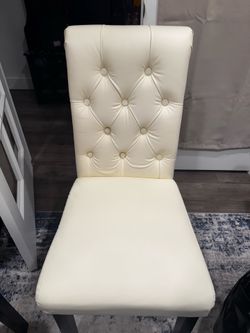 Crème colored dining room chairs
