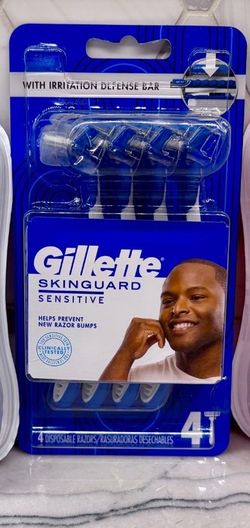 New Gillette SkinGuard Sensitive disposable razors. Pack has 4 blue and white razors with irritation defense bars. Designed for sensitive skin