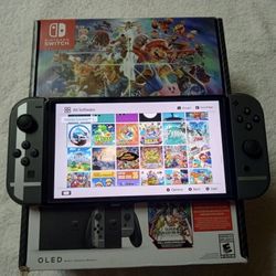 NINTENDO SWITCH OLED + 120 POOULAR SWITCH GAMES