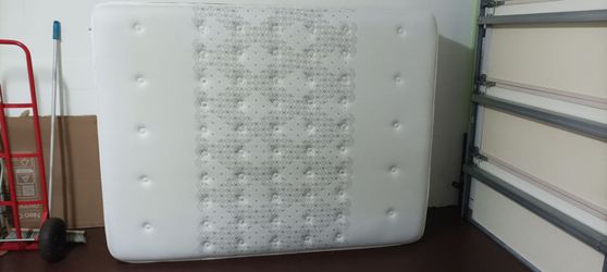 Queen size mattress, box spring and rails for sale.