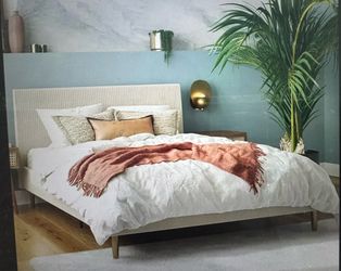 Ivory upholstered platform queen bed frame