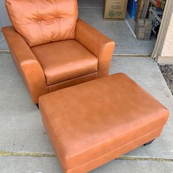 Paulie Orange Bonded Leather Chair & Ottoman from Benchcraft by Ashley Furniture