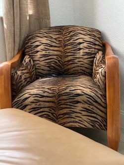 Tiger print with wooden arms. Good condition