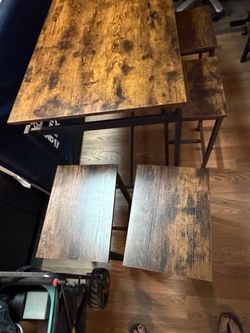 HIGH BAR TABLE WITH 4 STOOLS ALMOST NEW