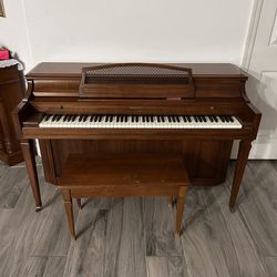 a Baldwin console/upright piano
