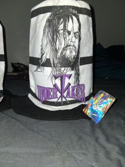 12 Brand new WWF released 1998 vintage Undertaker Stove Pipe Top Hat with official tags. Asking $10 each which equals $120 for all 12 which all are br