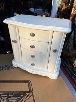 White wooden jewelry box with drawers and mirror
