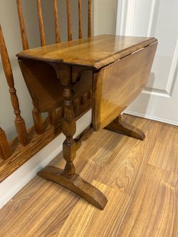 Antique mid century winged side table measuring 25” by 32” on top when winds are up and 23” tall