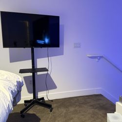 LG 43” 4K UHD Smart TV + Rolling Floor Stand – Excellent Condition