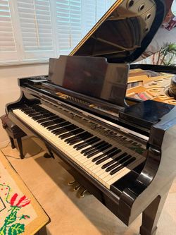 The 1977 K. Kawai KG-6C is a 7-foot-4-inch semi-concert Grand Piano with Real Ivory Keys