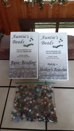 2 VHS BEADING VIDEOS WITH A BAG OF VARIOUS BEADS