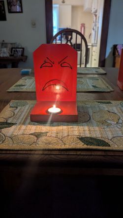 Reflective Halloween ghost with candle