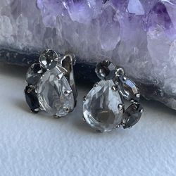 Tear drop shaped, clip-on earrings with 1 center piece clear stone, and 3 side pieces clear stones