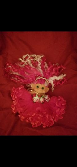 Troll with red lacy dress and red shoes.