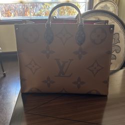 Loui Vuitton On The Move Bag