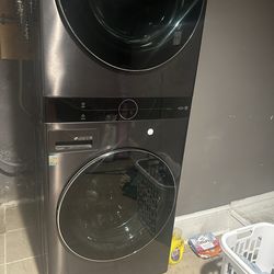 The LG WKEX200HBA is a 27-inch Smart Electric WashTower in Black Steele