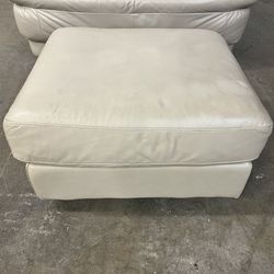 Beige Leather Ottoman on wheels. Footstool. Free to ask, I reply