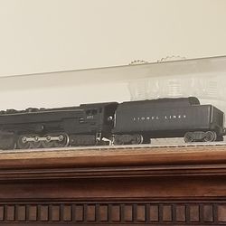 LIONEL 671 STEAM ENGINE AND COAL CAR IN EXCELLENT CONDITION WITH DISPLAY CASE. A RARE FIND $700.