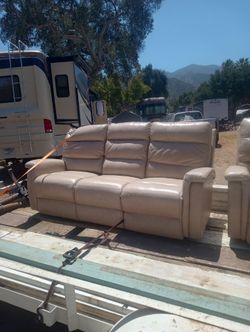 Tan Leather couches. Electric recliners.