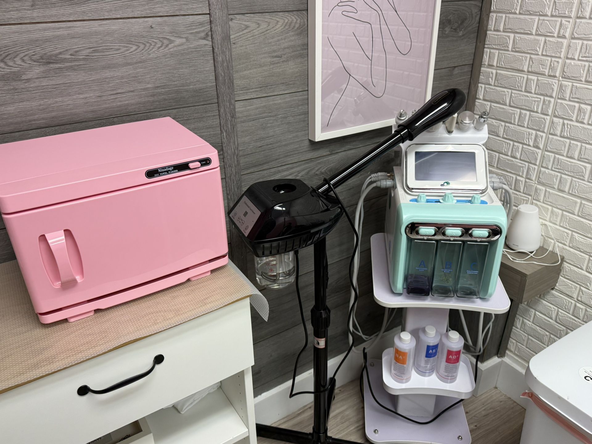 Facial steamer, towel warmer and hydrafacial machine. 