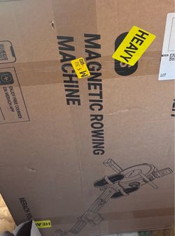 Magnetic rowing machine