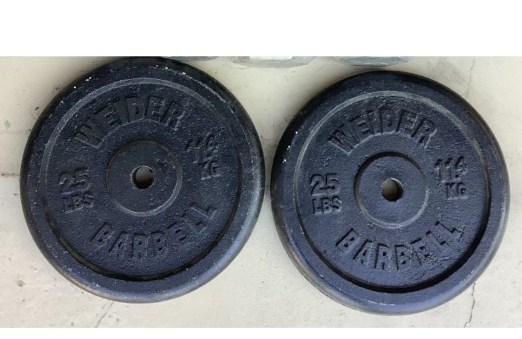 (2) 25 lbs Iron Weider Barbell Plates.