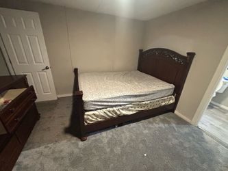 Dark Wood Queen Bed Frame with Carved Headboard